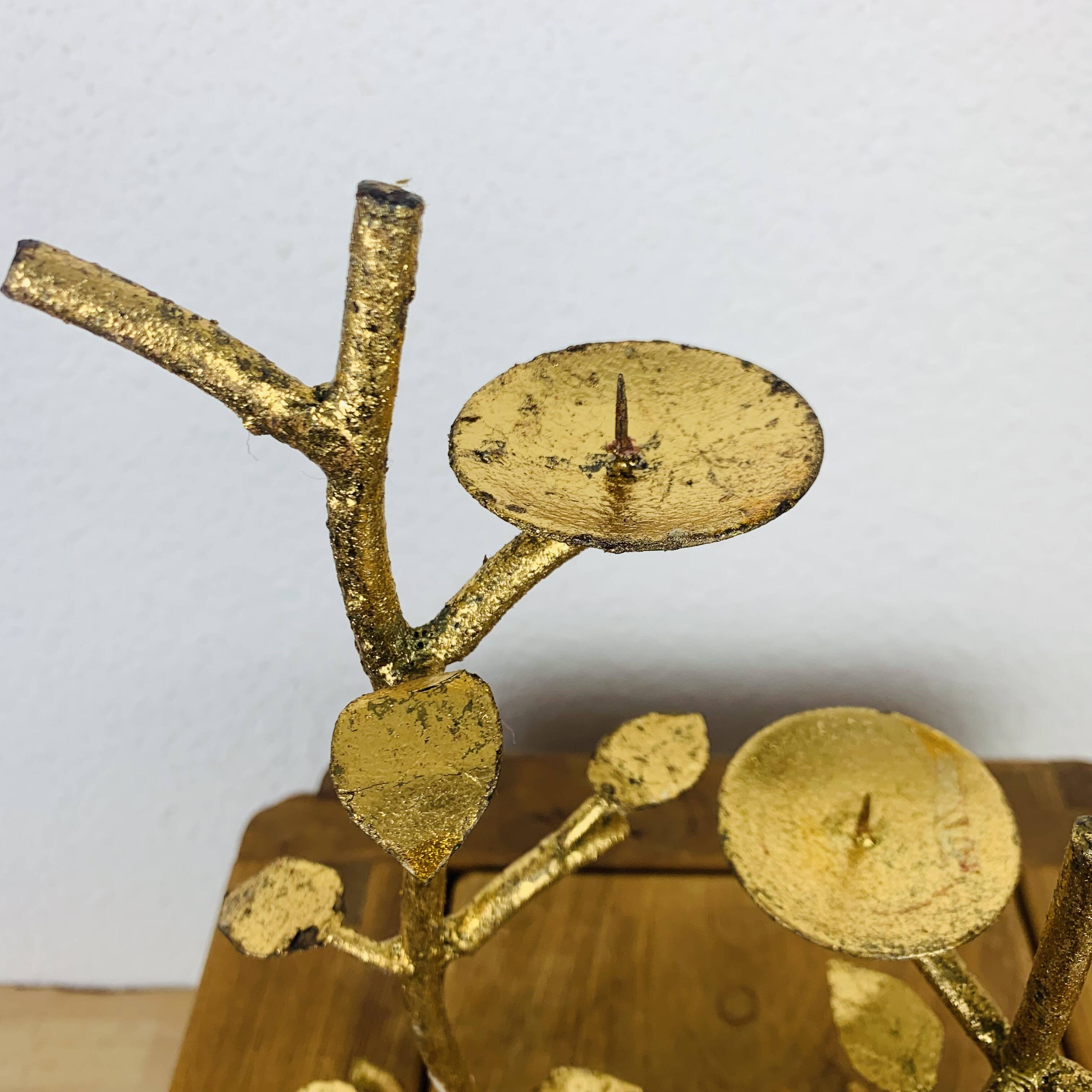 Pair of golden foliage candlesticks