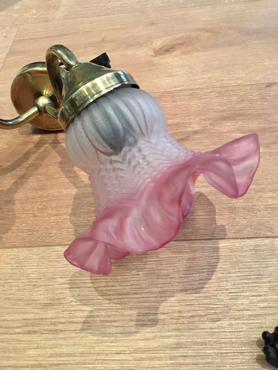 Pair of brass sconces and pink glass