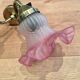 Pair of brass sconces and pink glass