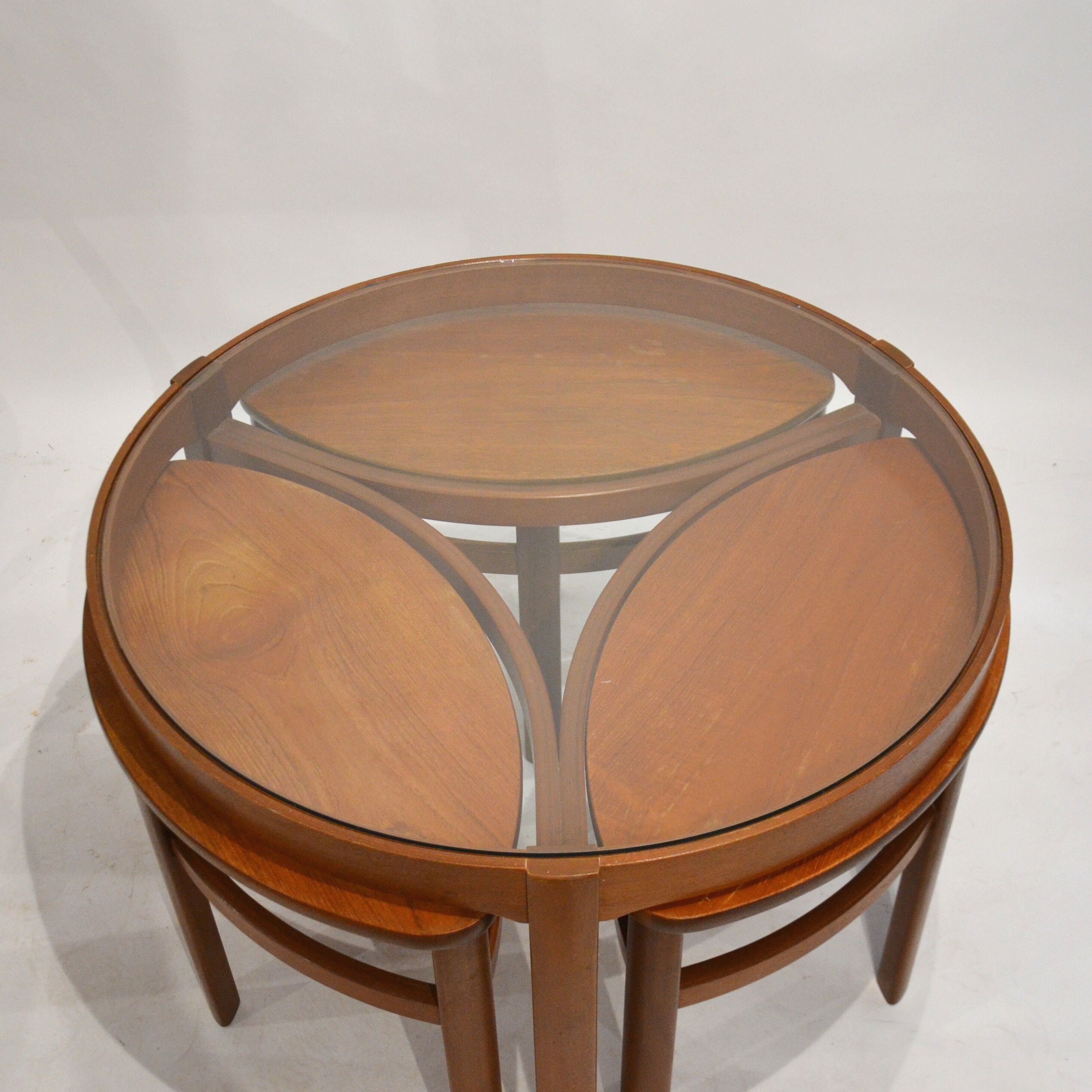 Glass and teak pull out coffee tables