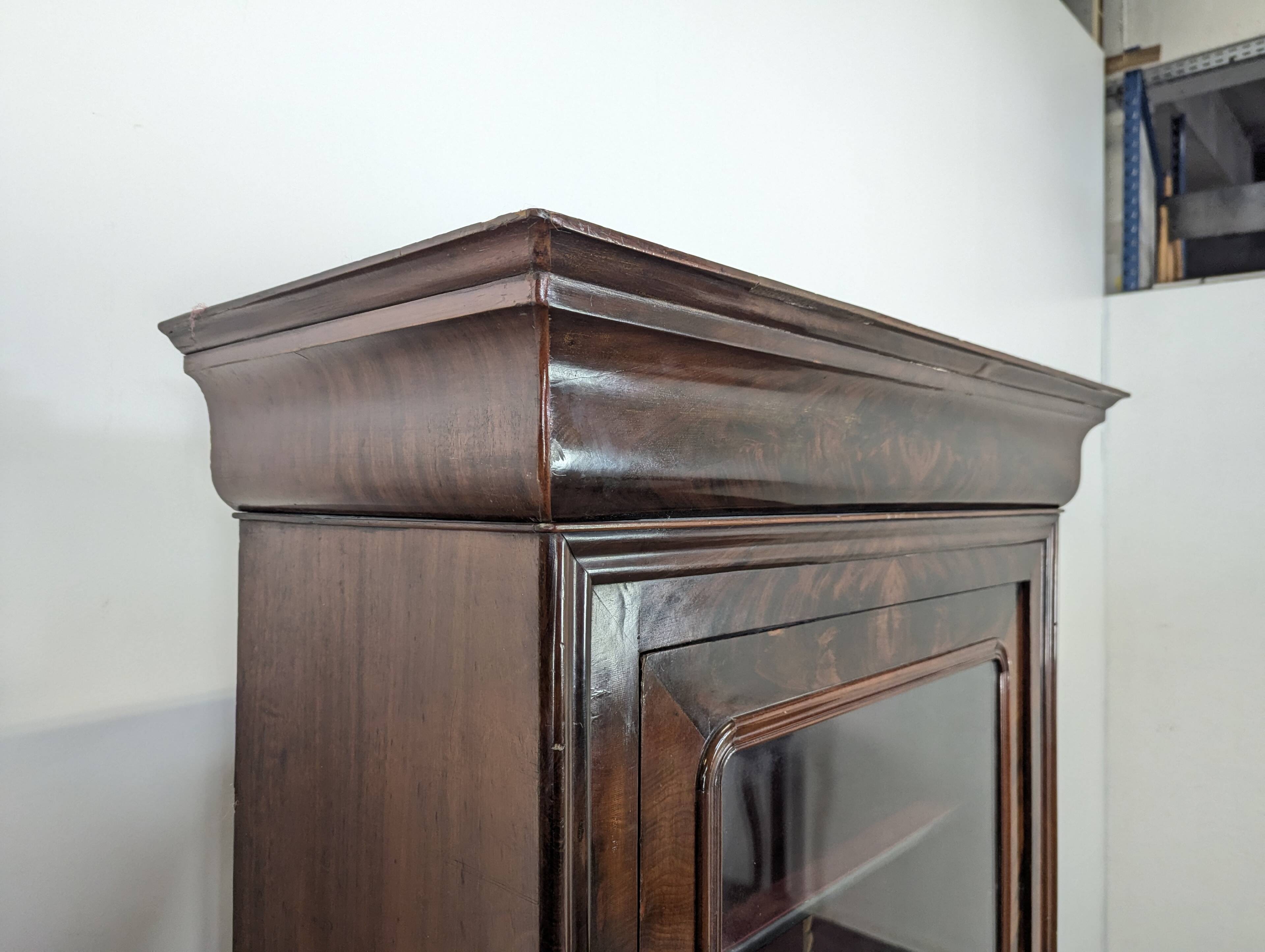 Louis Philippe period glass cabinet in flamed mahogany