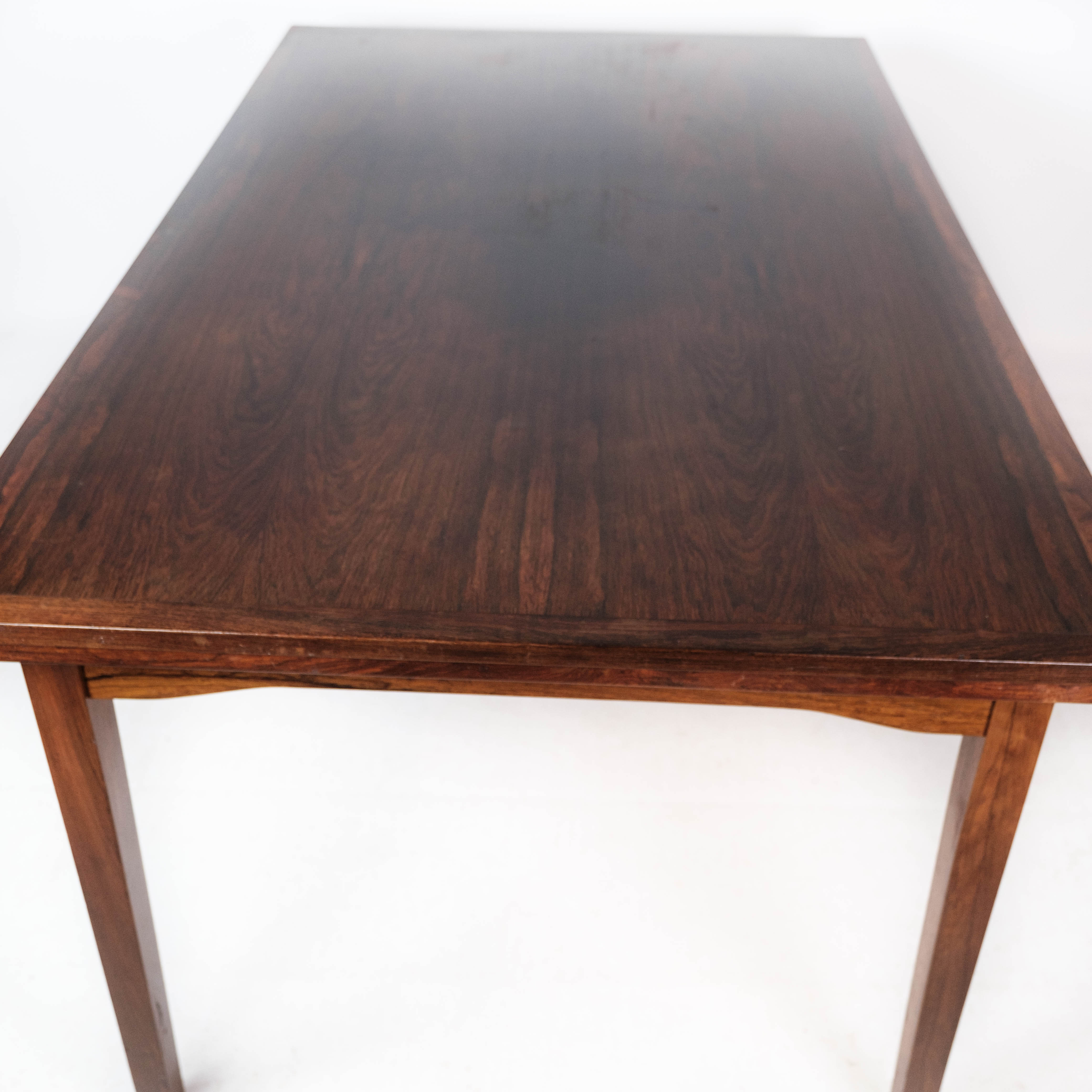 Dining table in rosewood with extension, of Danish design by Ellegaards Furniture, 1960s