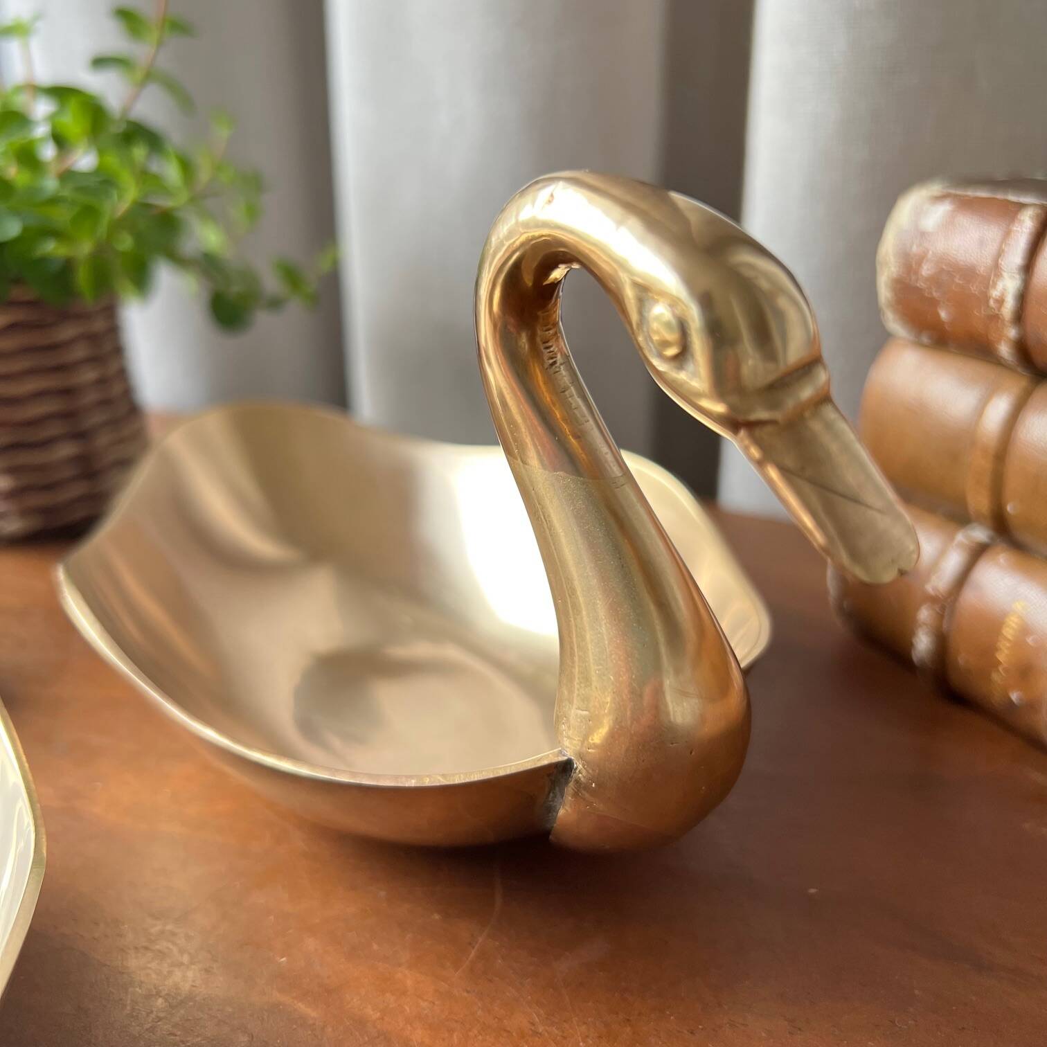 Trio of “swan” cups in gilded brass