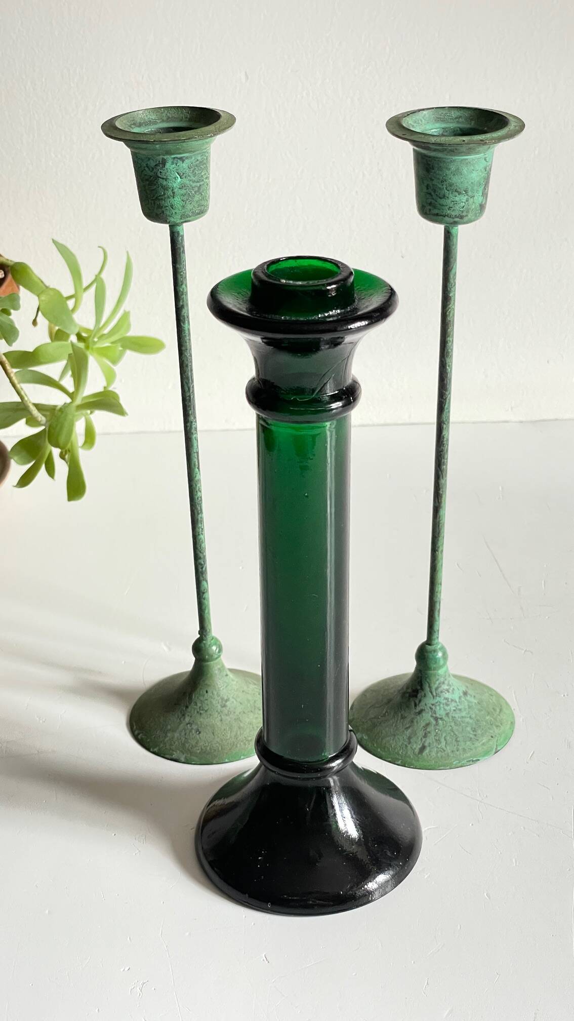 Green glass and metal candle holders