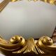 Hexagonal mirror in gilded wood