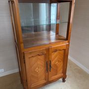 Louis XV style display cabinet, glass doors and chevron panels.