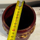 Mid-century relief vase in ruby red enhanced with gilding.