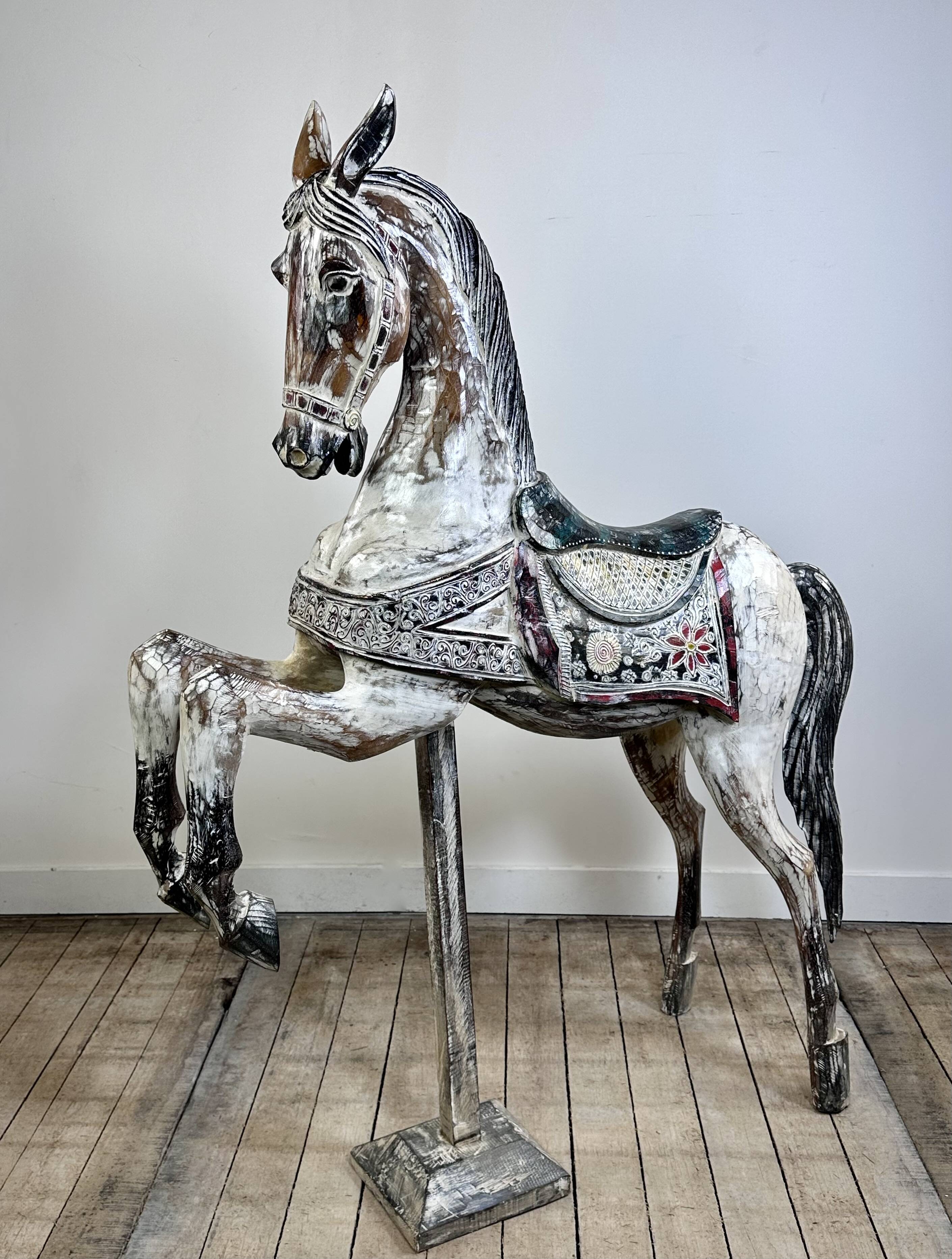 Carved and patinated wooden carousel horse