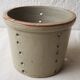 Pot with pheasant in earth