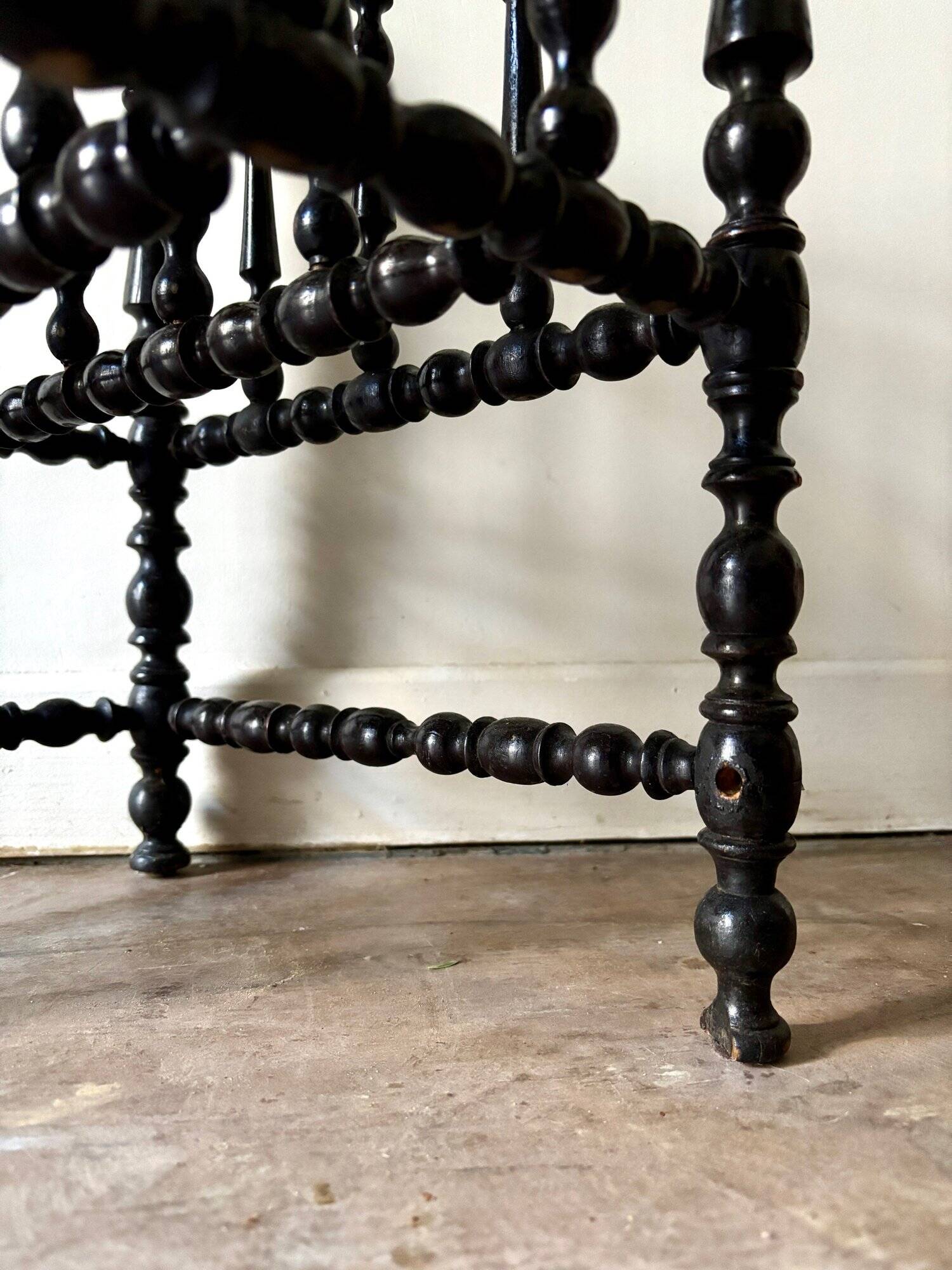 Napoleon III magazine rack in black turned wood