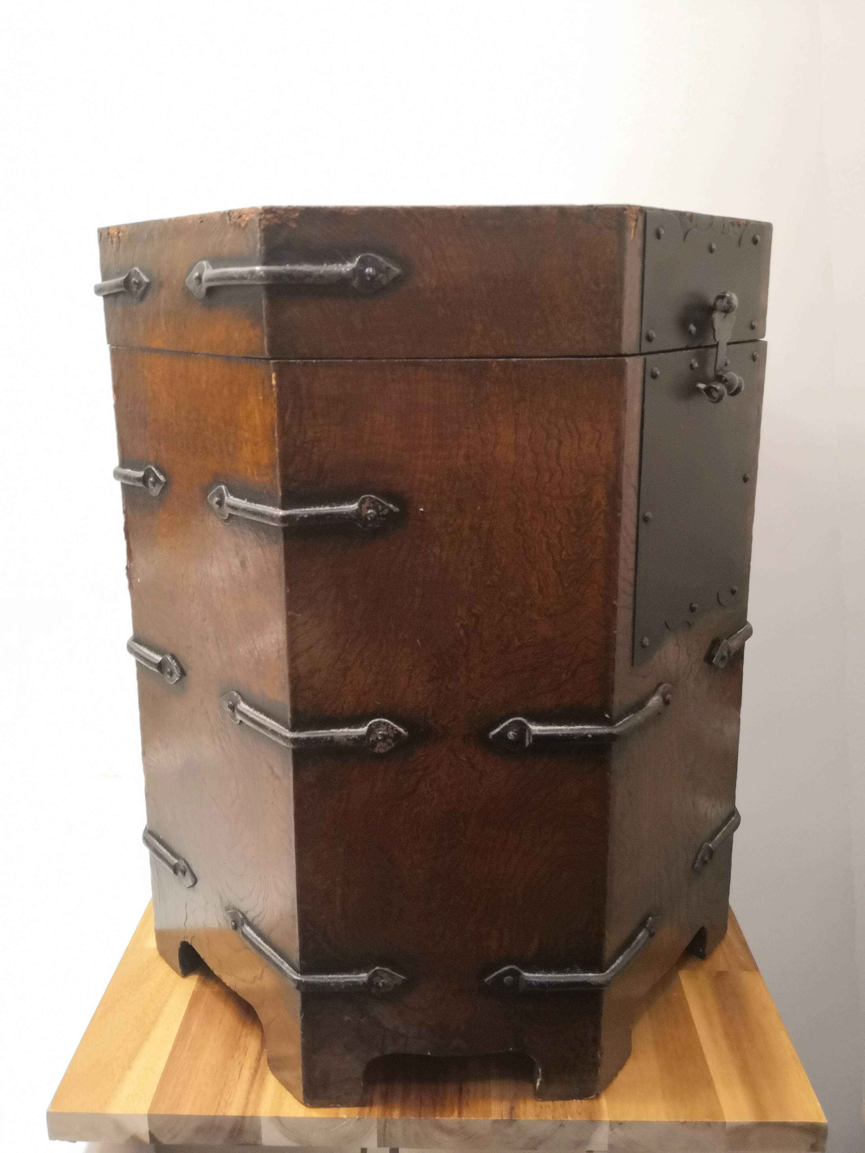 Octagonal wooden chest with metal ornaments from Asia