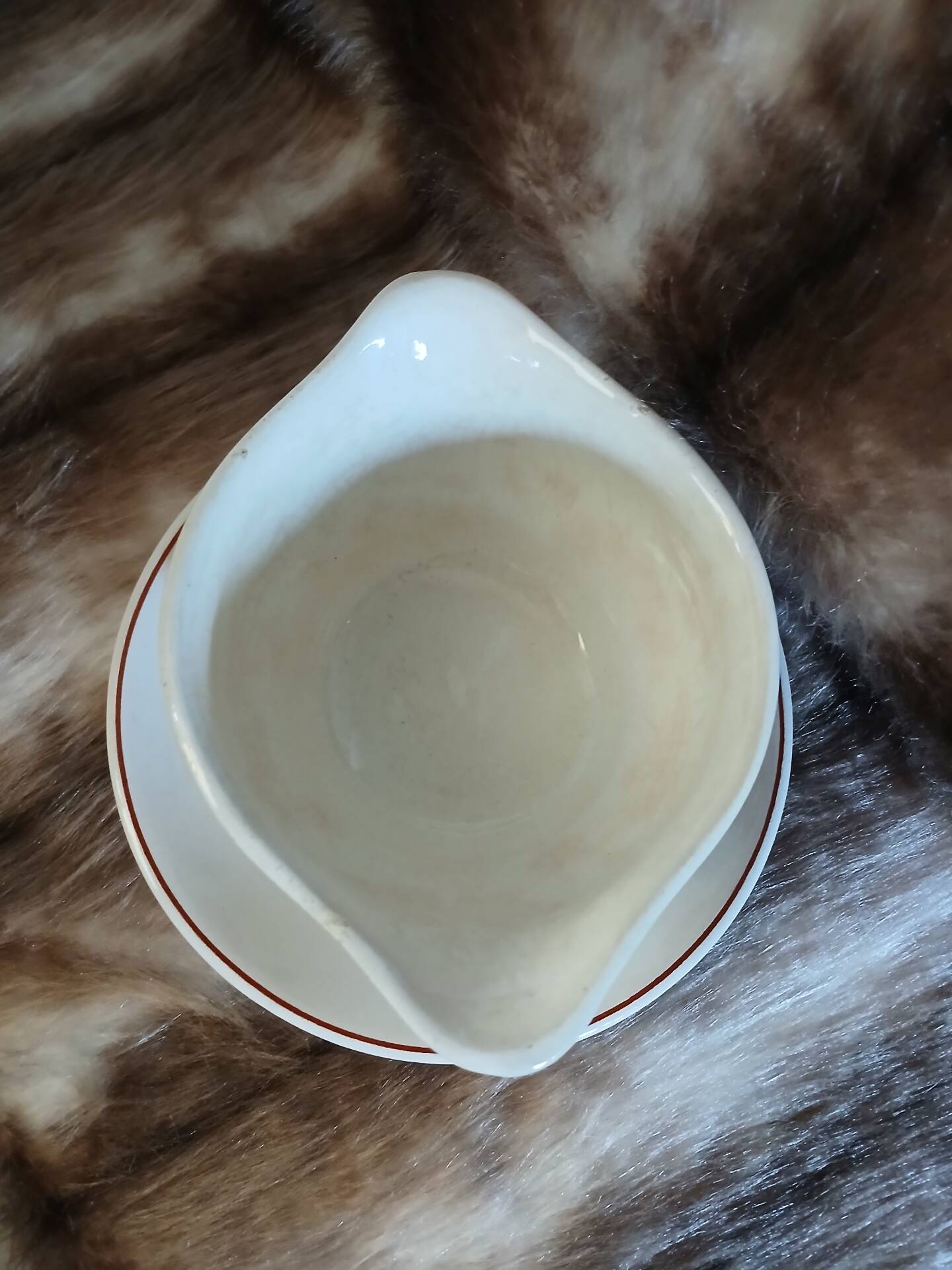 Antique sauce boat in Longchamp ironstone.