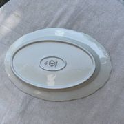 Large yellow porcelain serving dish by Bernadotte from the 1960s, with a gold rim and relief.