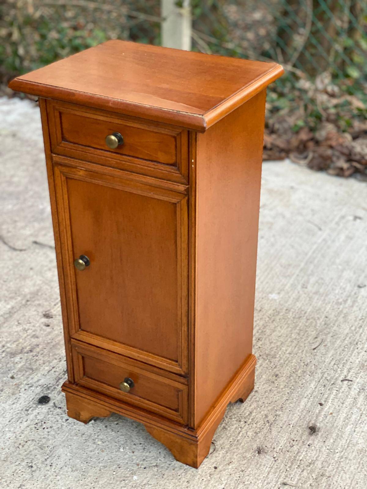 Solid wood bedside table with drawers and door
