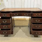 English desk with drawers from the 1950s in mahogany with a leather top.