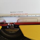 Vintage yellow portable typewriter, functional, AEG, new ribbon