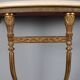 Old neoclassical consoles in gilded bronze from the 20th century.