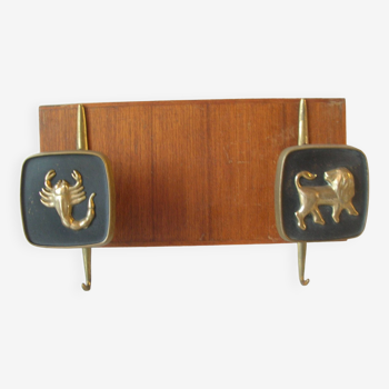 Old coat rack with 2 hooks from the 1950s astro sign Lion Scorpio in bronze