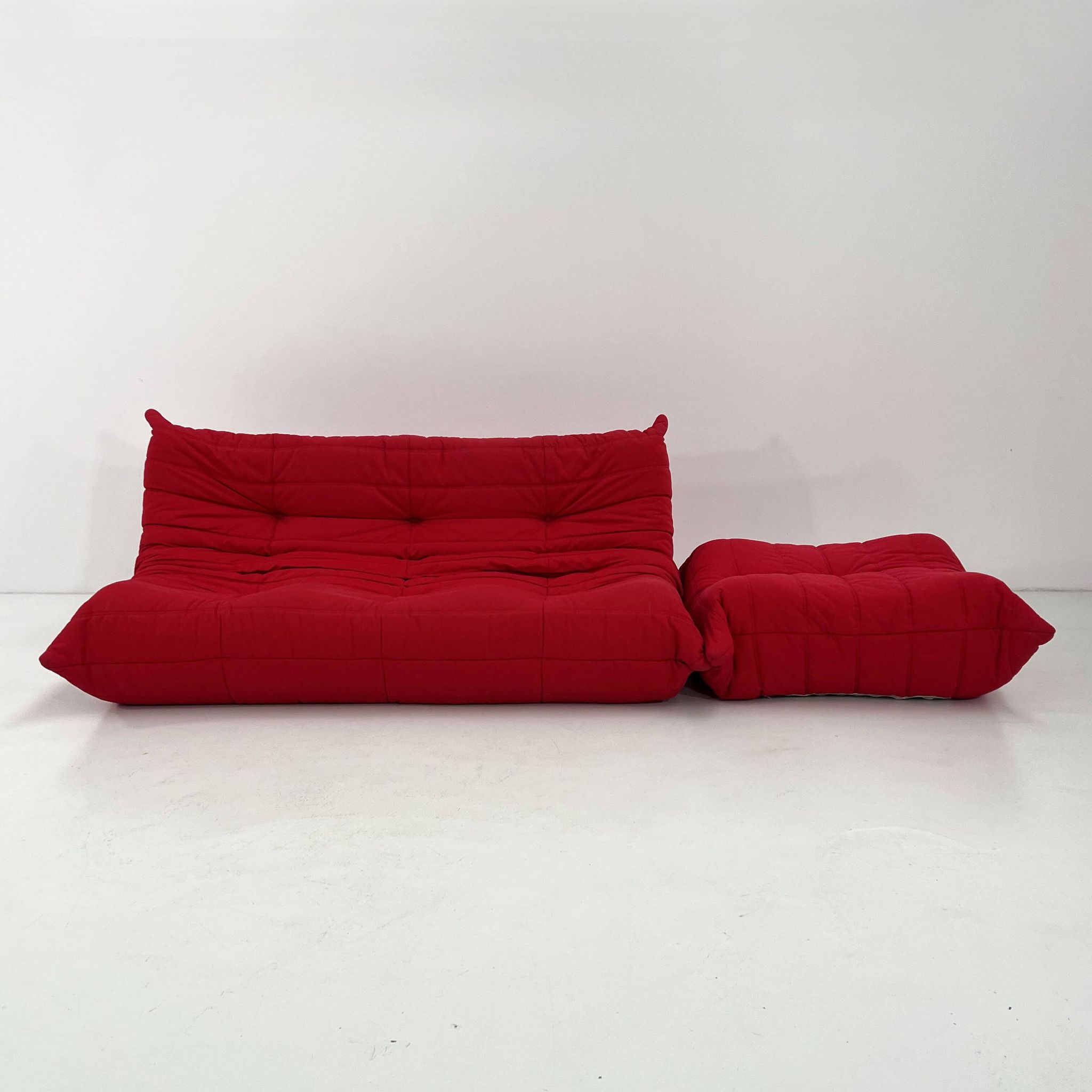 Togo 3-seater with red ottoman by Michel Ducaroy for Ligne Roset, 1970.