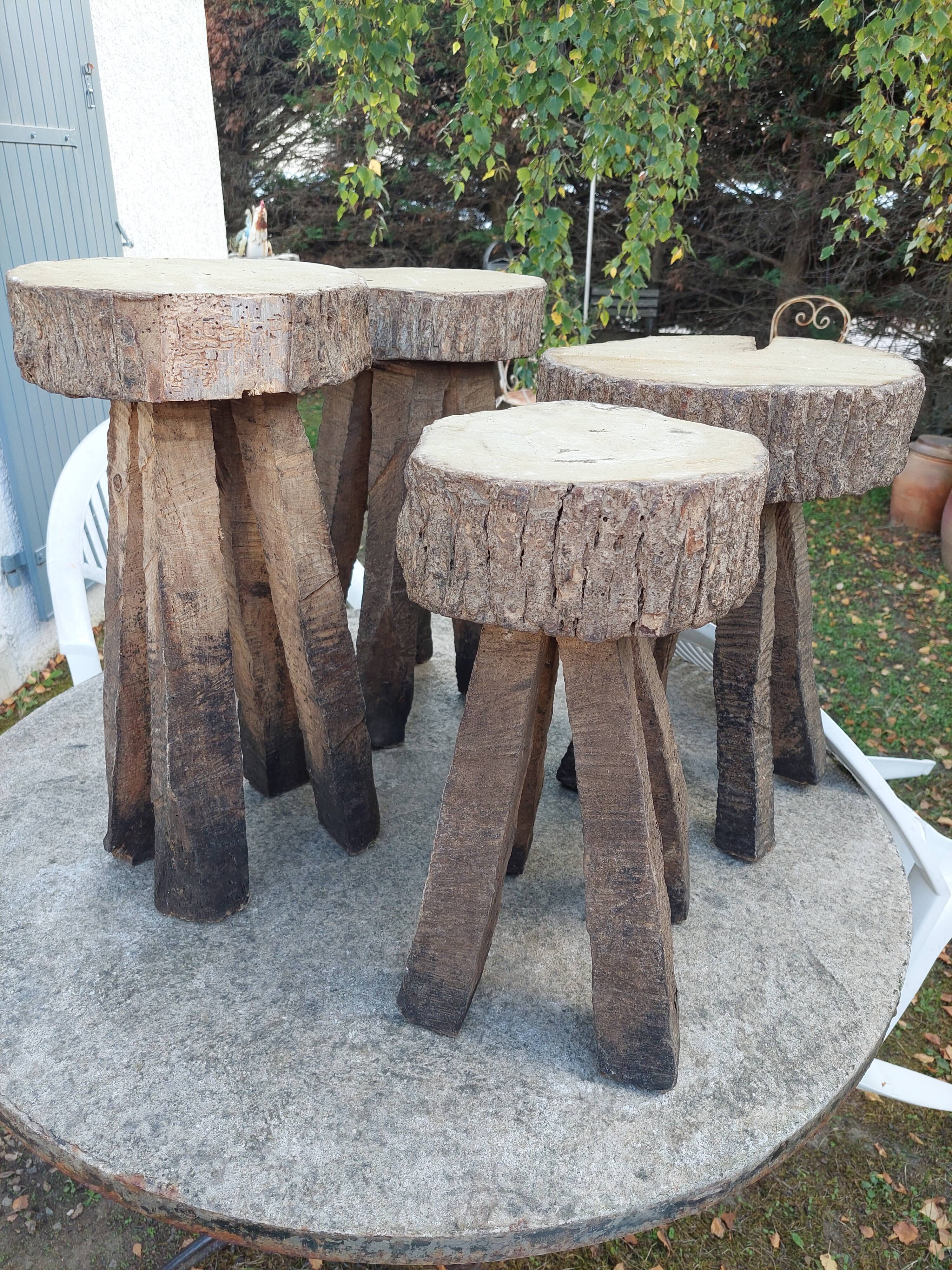 4 stools in raw wood brutalist art