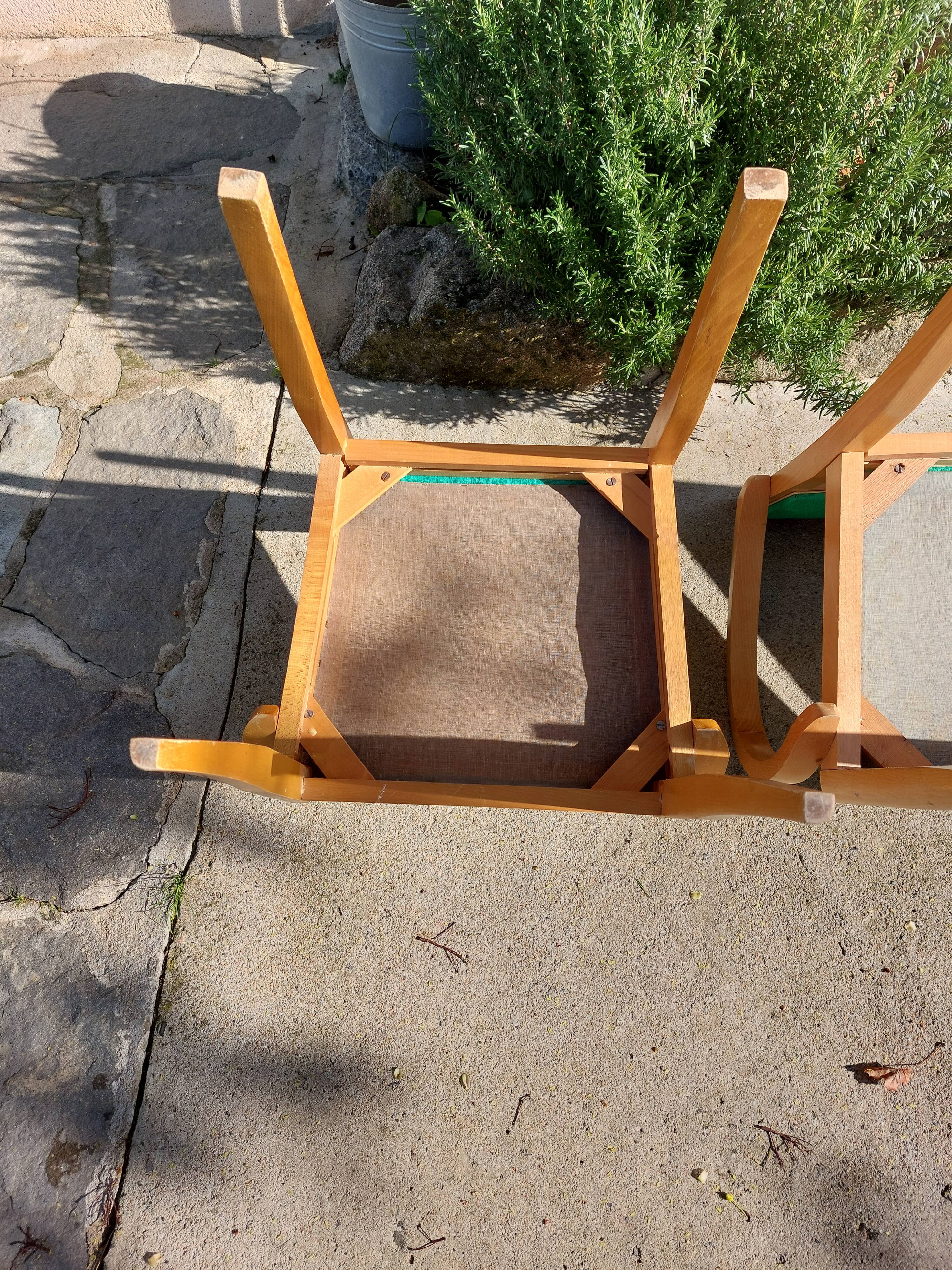 3 vintage bridge chairs with rounded armrests.