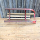 Red sled in metal and wood in the 1960s