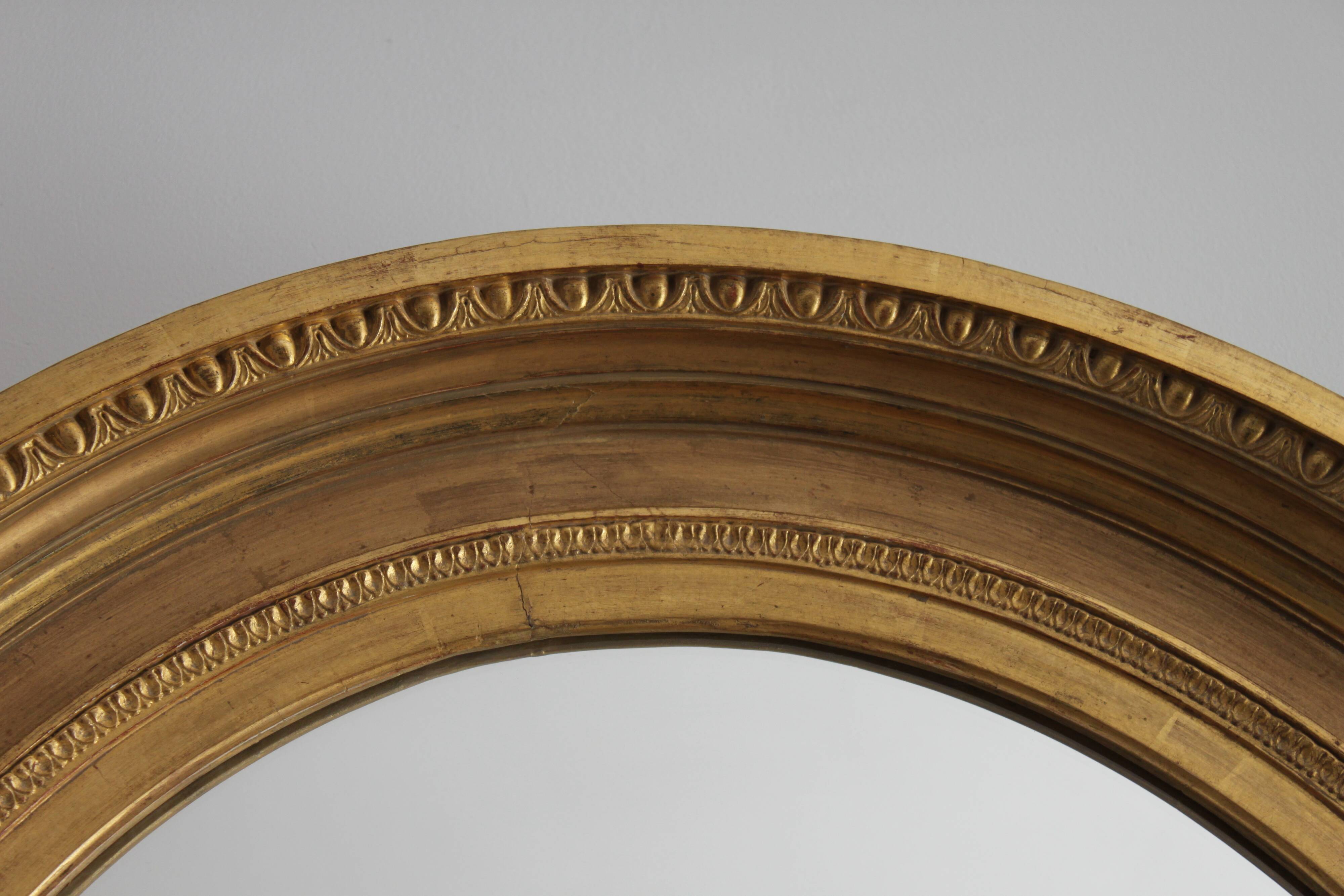 Mirror antique medallion gilded with gold leaf