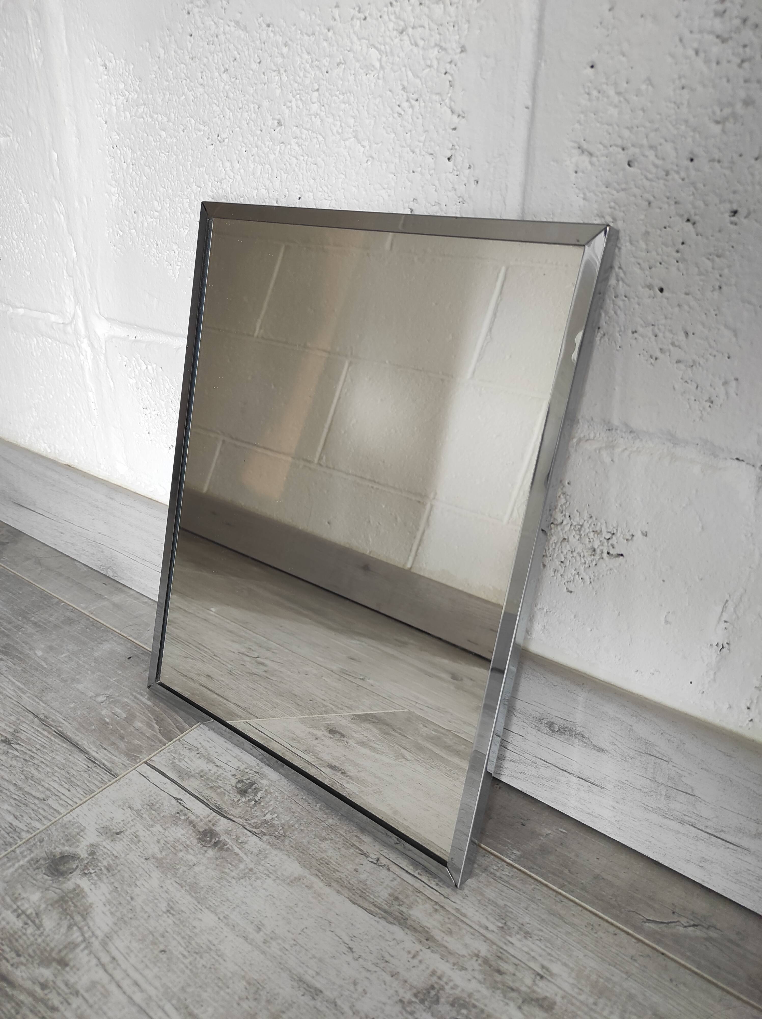 Vintage mirror with silver metal frame to hang