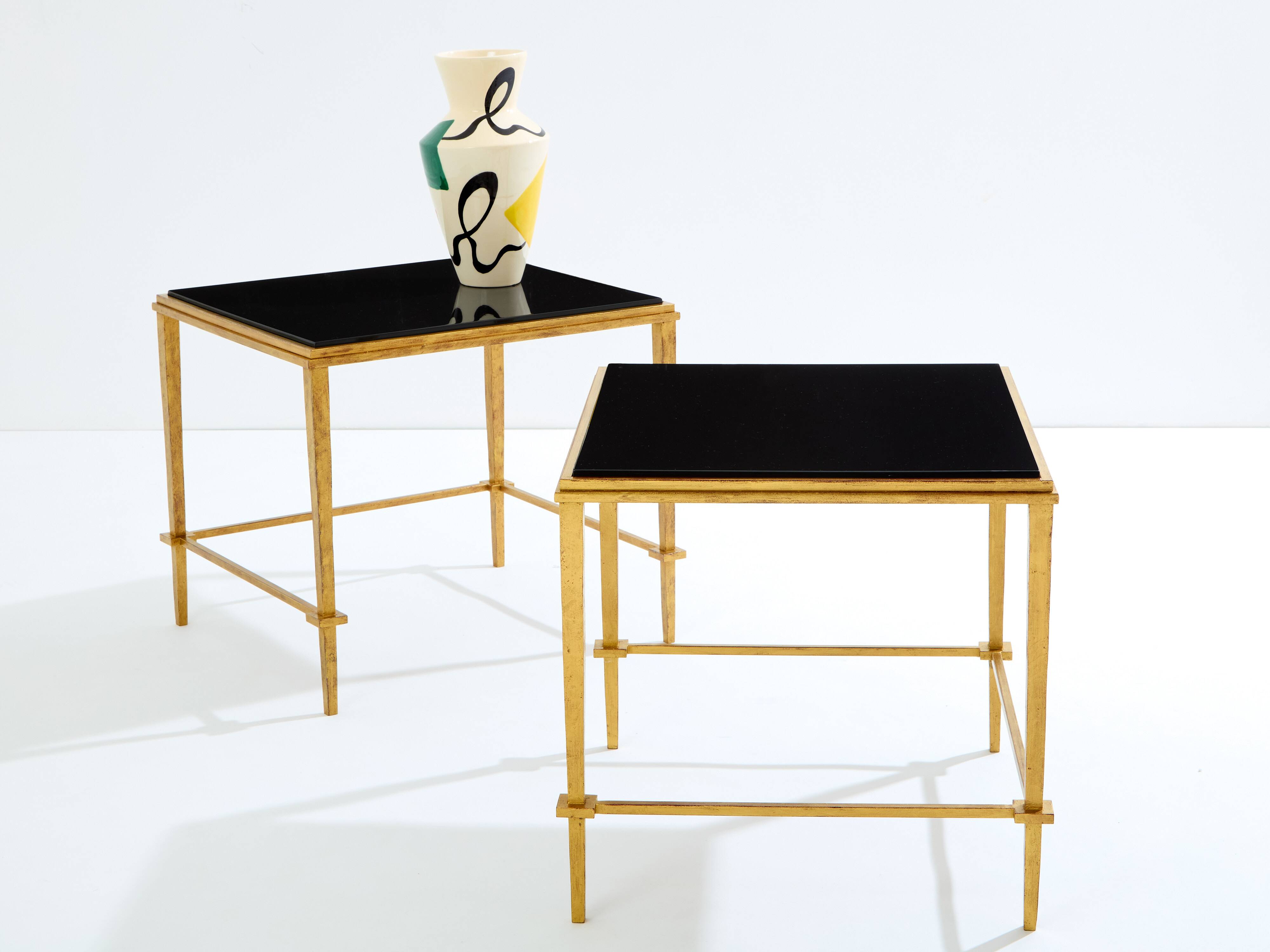 Pair of side tables in gilded iron and black lacquer Maison Ramsay 1950