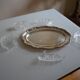 Silver-plated metal aperitif serving tray with HKE hallmark and glass.