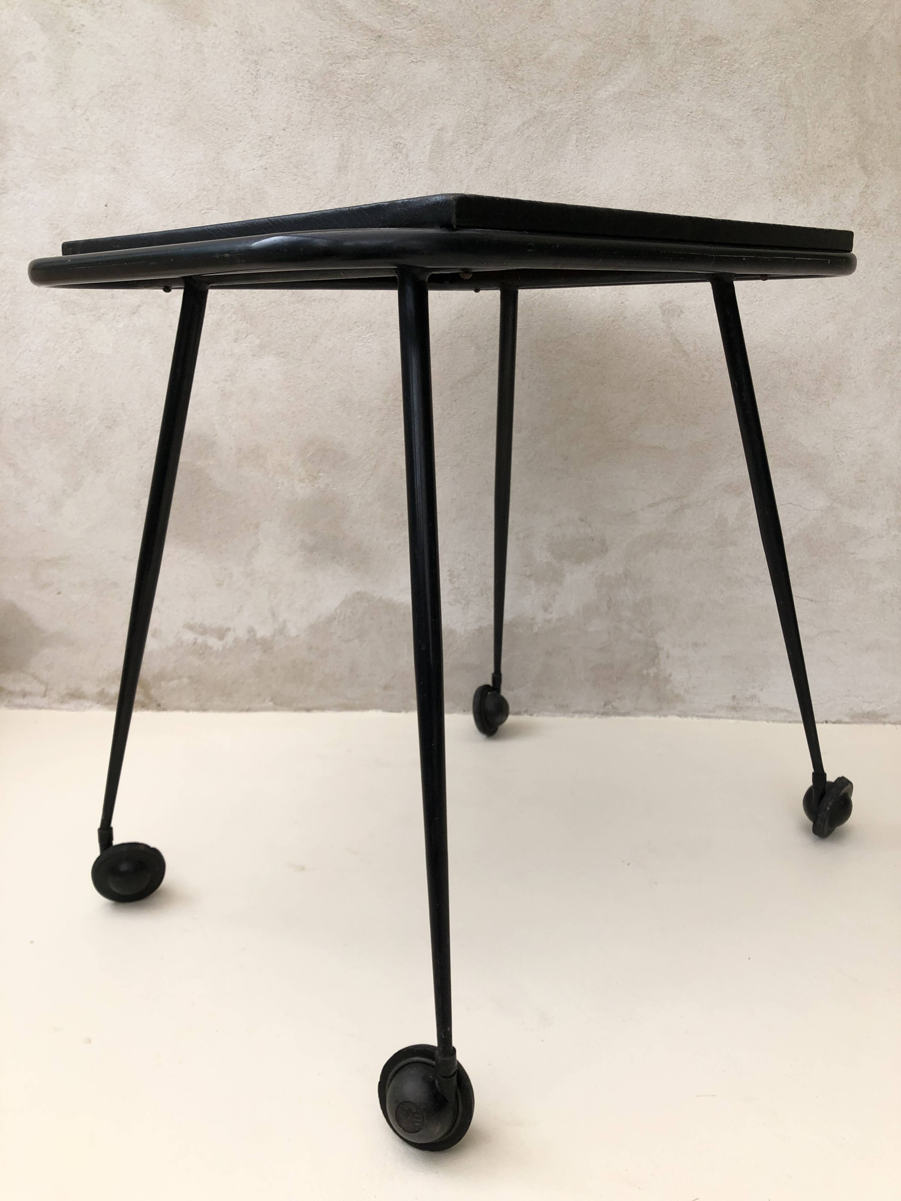 Black table on wheels from the 60s