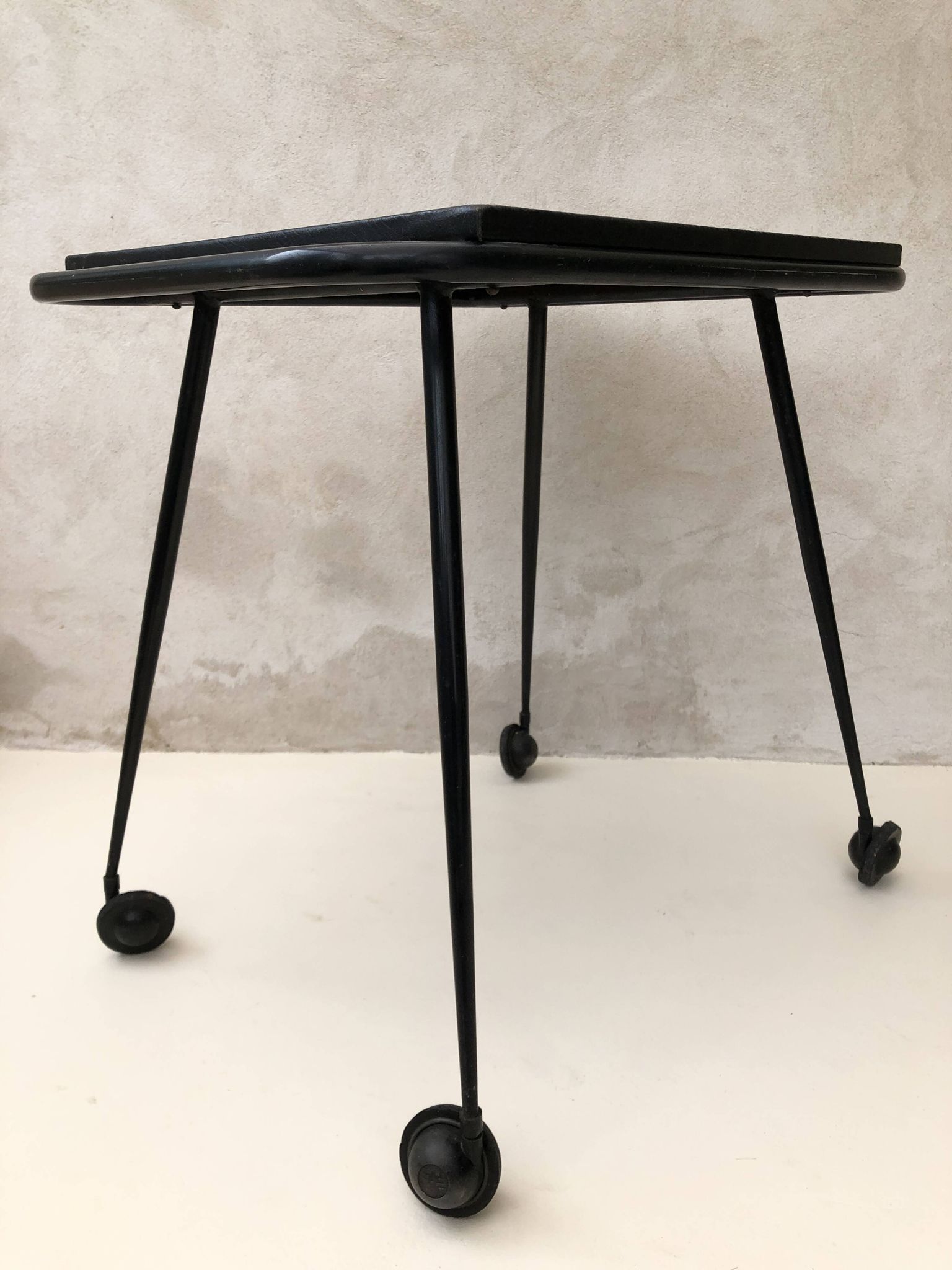 Black table on wheels from the 60s
