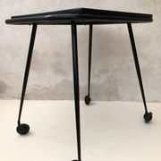 Black table on wheels from the 60s