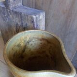 Vintage pitcher with enamelled earth cove