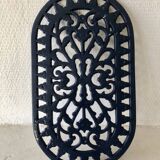 Cast iron trivet made of enameled cast iron