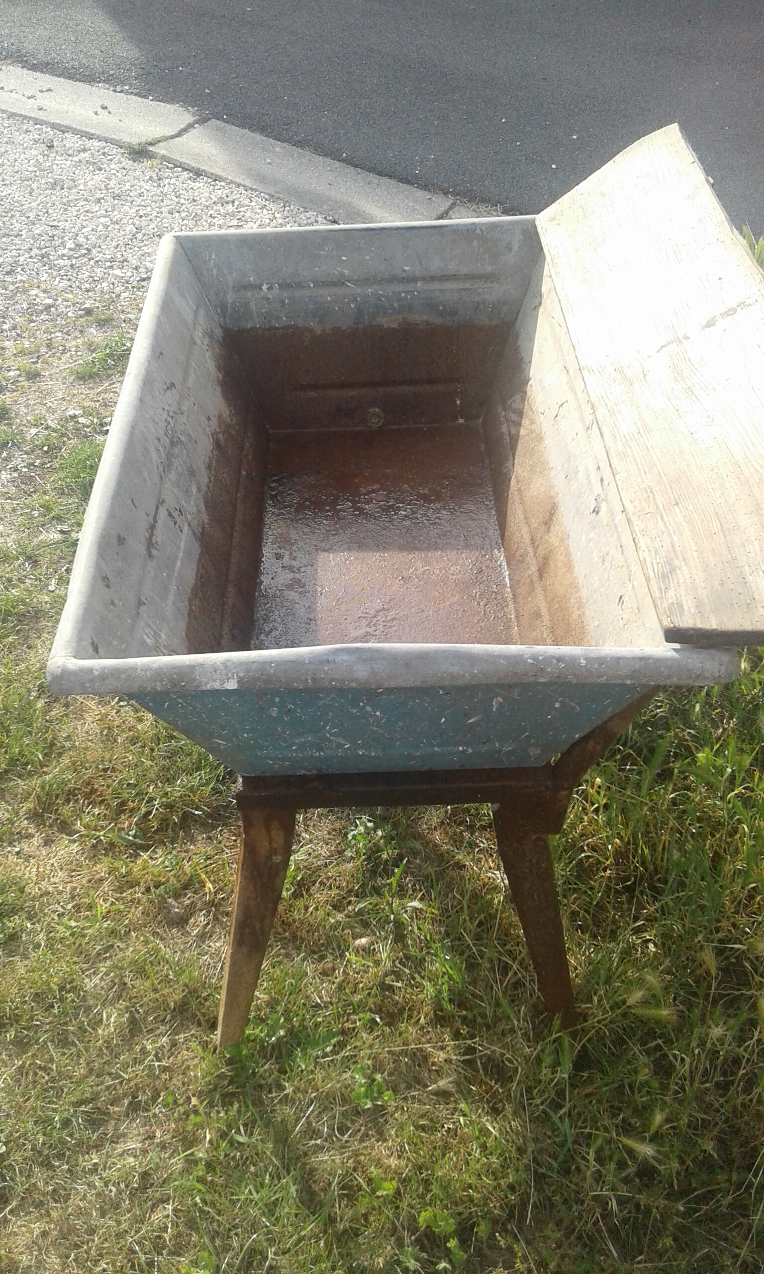Old galvanized wash on foot