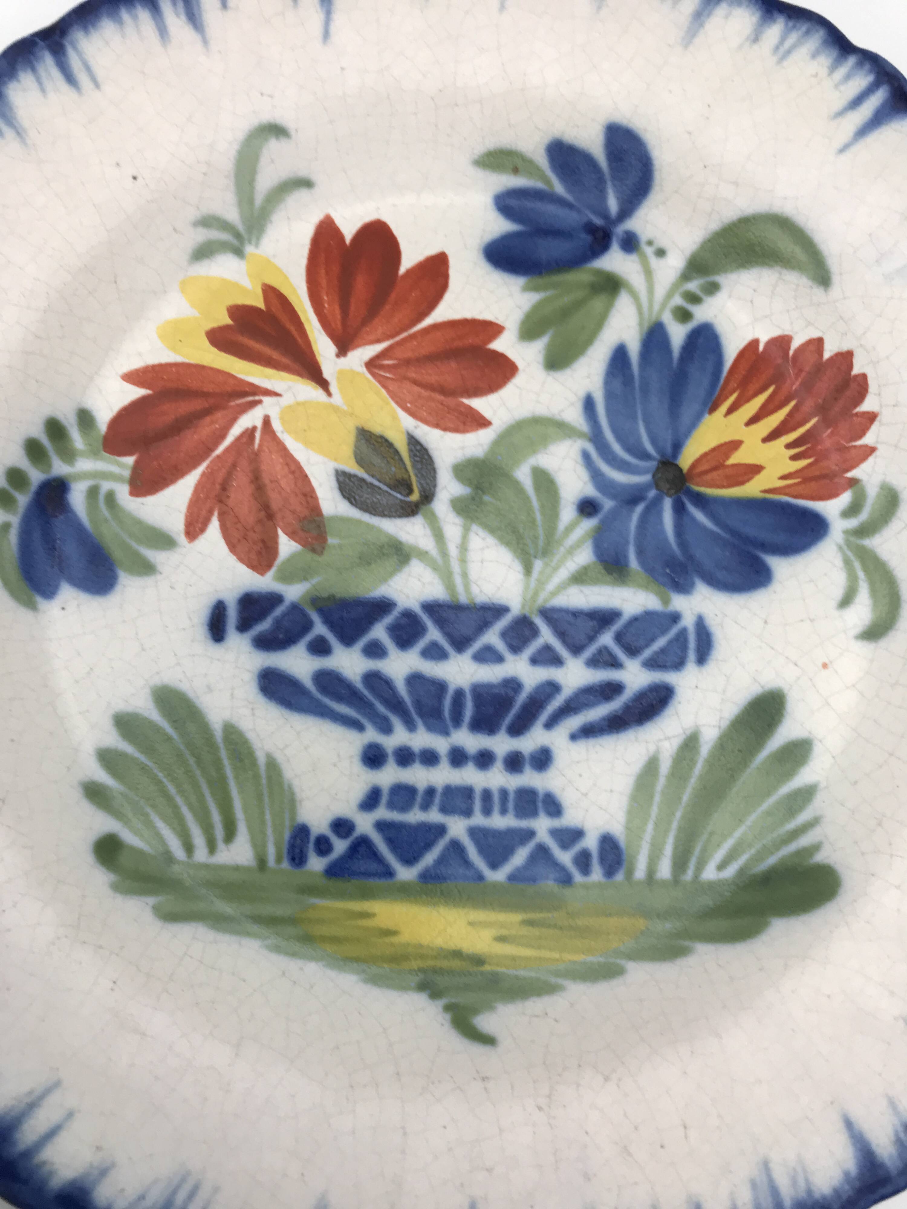 Antique auvillar earthenware plate decorated with basket of polychrome flowers