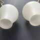 Pair of vintage wall sconces in gilded brass and opaline glass from the 1950s.