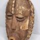 Decorative African mask in carved wood and cowrie shells, Baoulé style, 34 cm