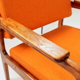 Vintage armchair in papaya orange wool from the 1960s.