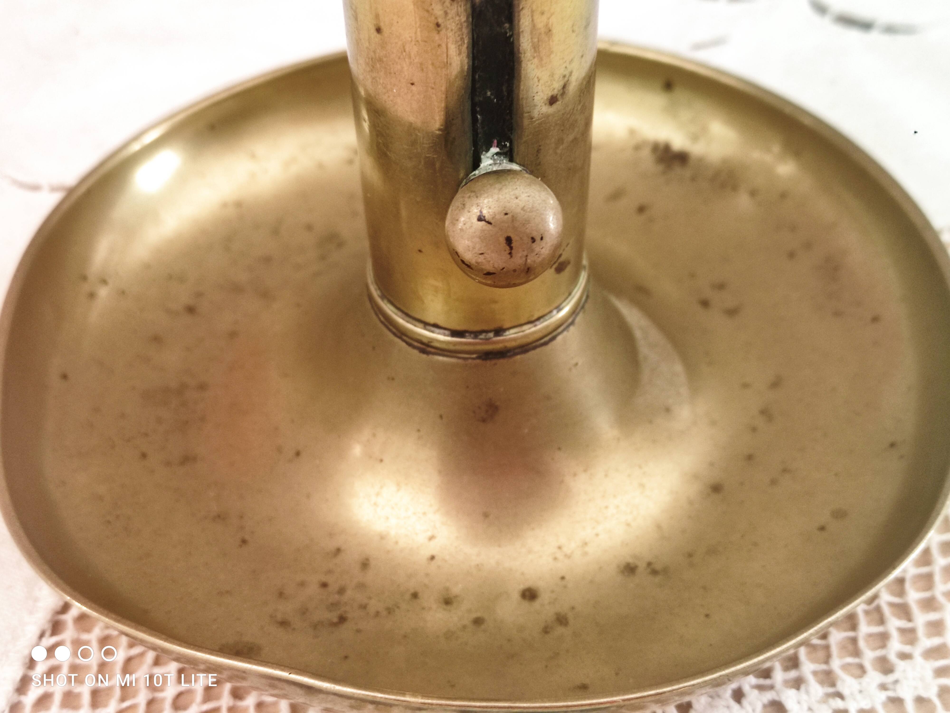 Brass push candle holder on frame