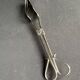 Cake tongs and spoon to sprinkle silver metal