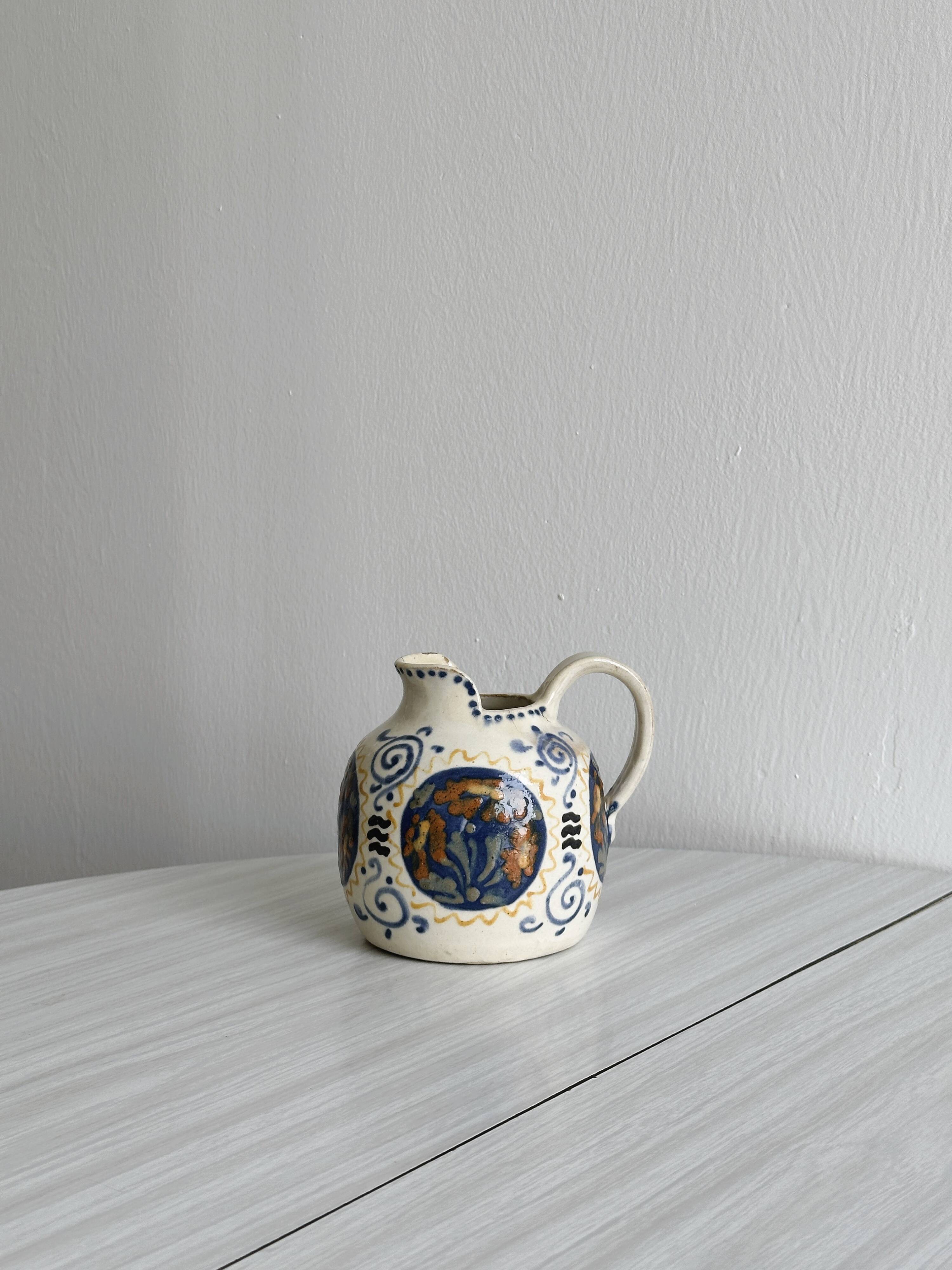 Hand painted ceramic decorative pitcher