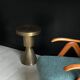 Sculptural metal side table, contemporary brassy side for modern interiors