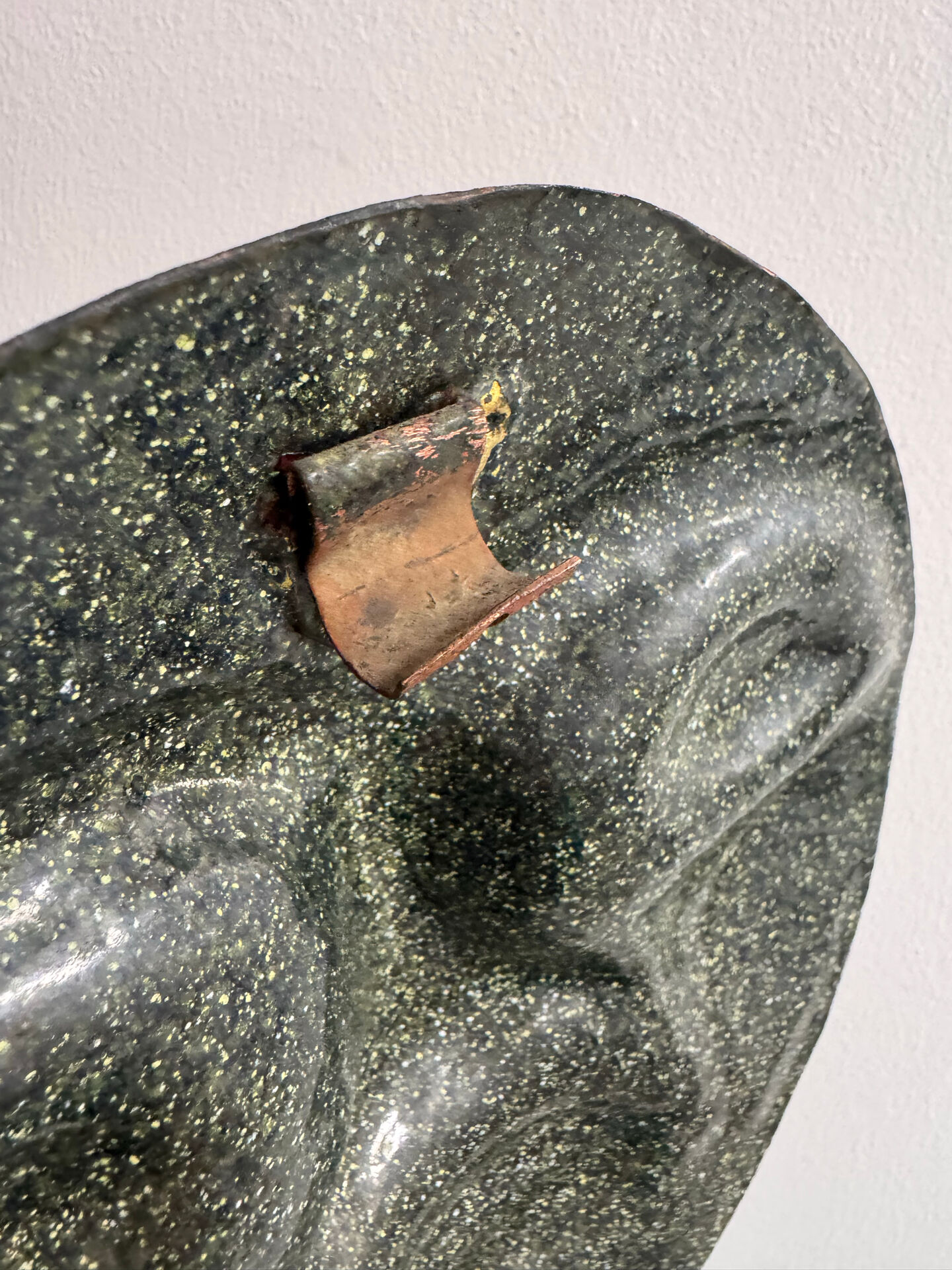 Sculpture face in embossed enamelled brass from the 1960s.