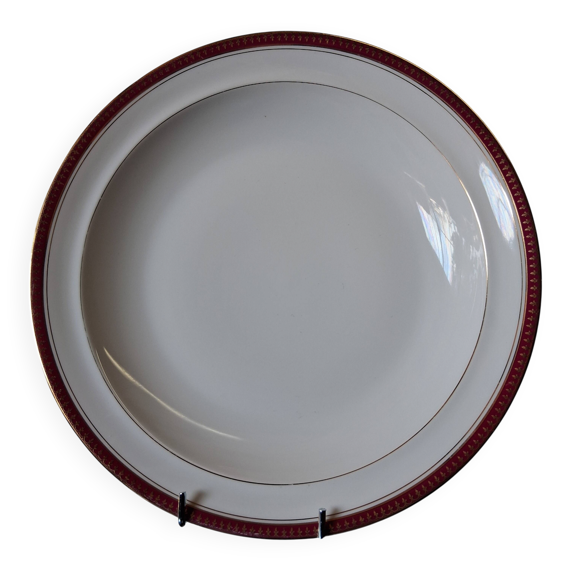 Round hollow serving plate in porcelain from Chastagner et Cie in good condition.