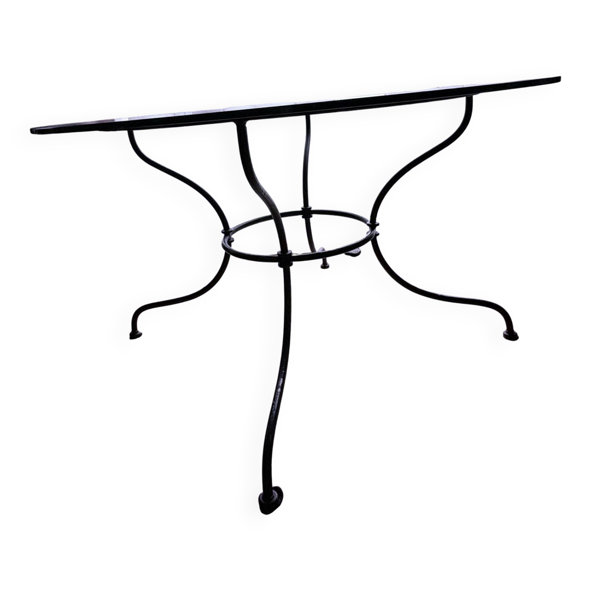 Round dining table in glass and wrought iron.