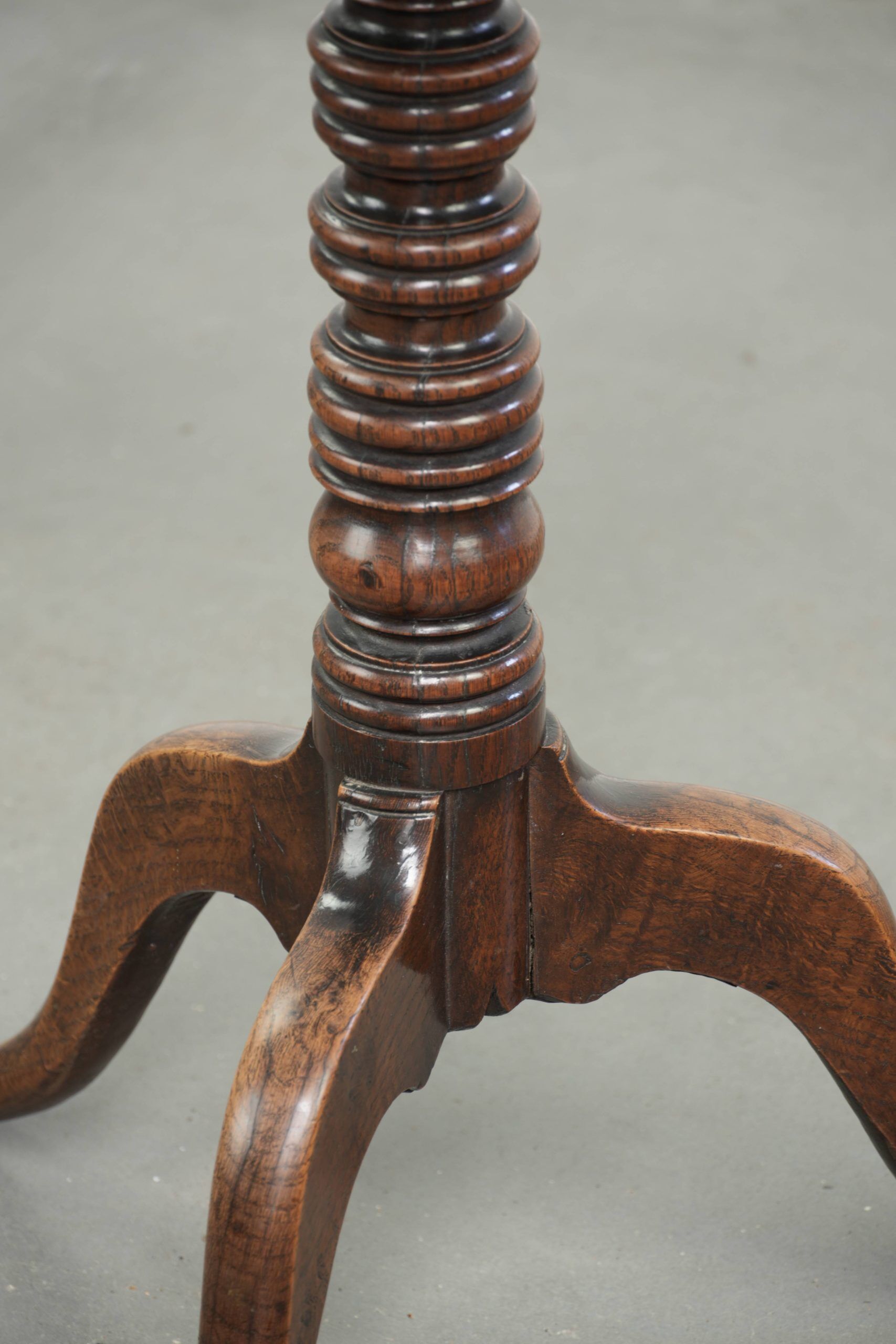 Antique English oak tilt top table from the 19th century in a unique shape