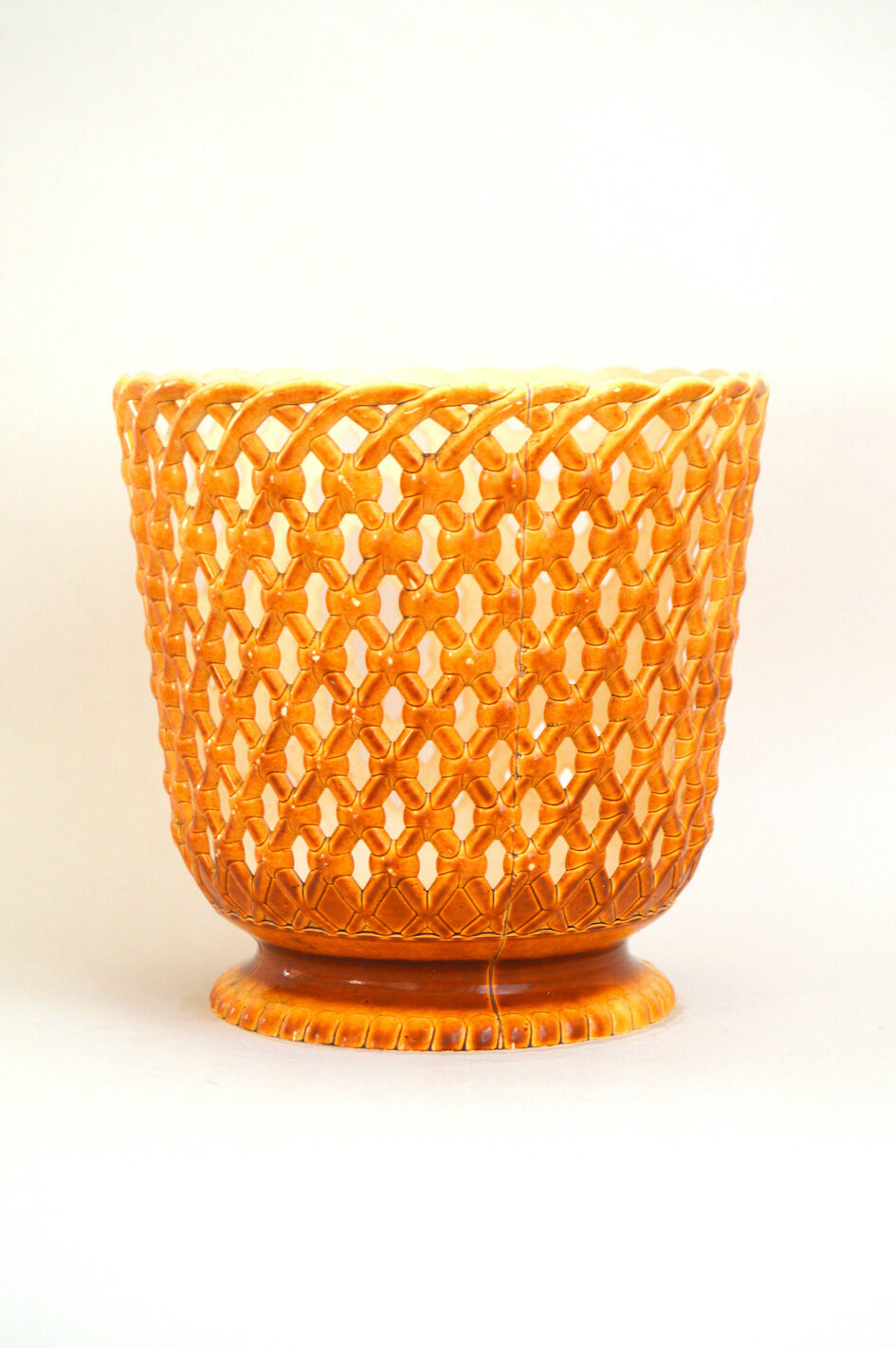 Orange openwork pot cover