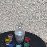 Liquor service consisting of a carafe and 6 small shot glasses, houndstooth pattern